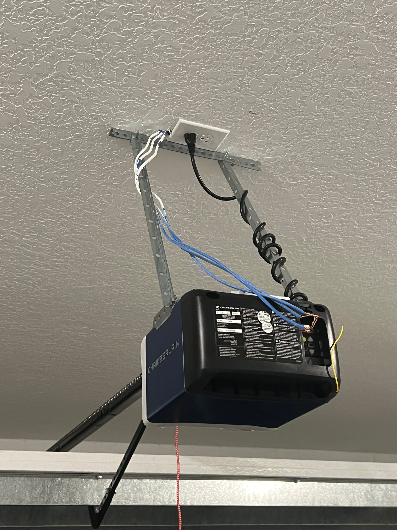 Smart garage door opener installed on ceiling